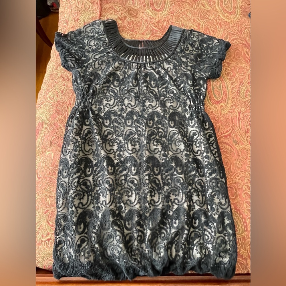 Black lace balloon dress with elastic sleeve, side and bottom hem.